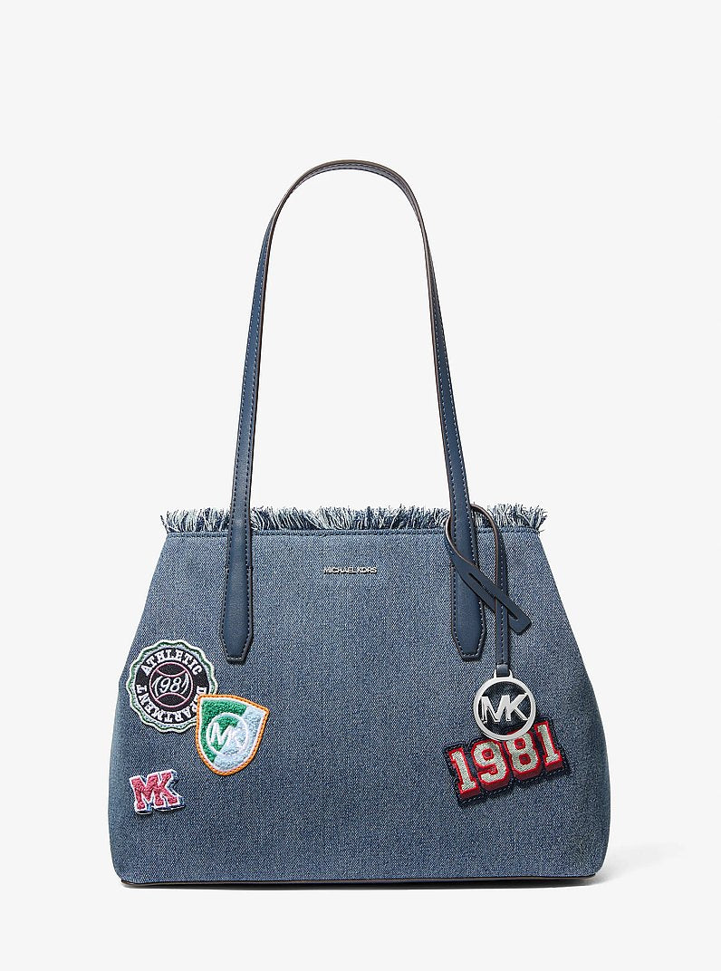 Michael Kors Avalon Medium Embellished Denim Convertible Tote Bag en Washed Denim — vista frontal | Original Export