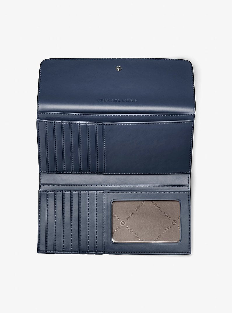 Carteira Michael Kors Jet Set Travel Signature Logo Tri-Fold Wallet, Lona com Logo Signature, cor Jeans Multicolor, vista lateral | Original Exports