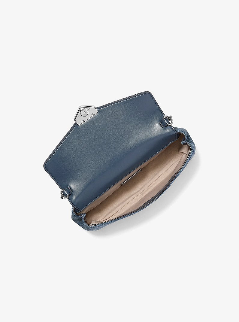 Michael Kors Soho Small Embellished Denim Convertible Crossbody Bag en Washed Denim — vista lateral | Original Export